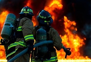 Image of fire fighters practicing fire safety