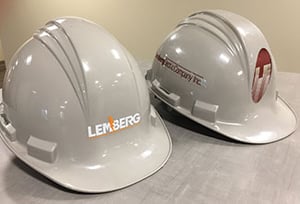 Lemberg hard hat before and after rebranding.